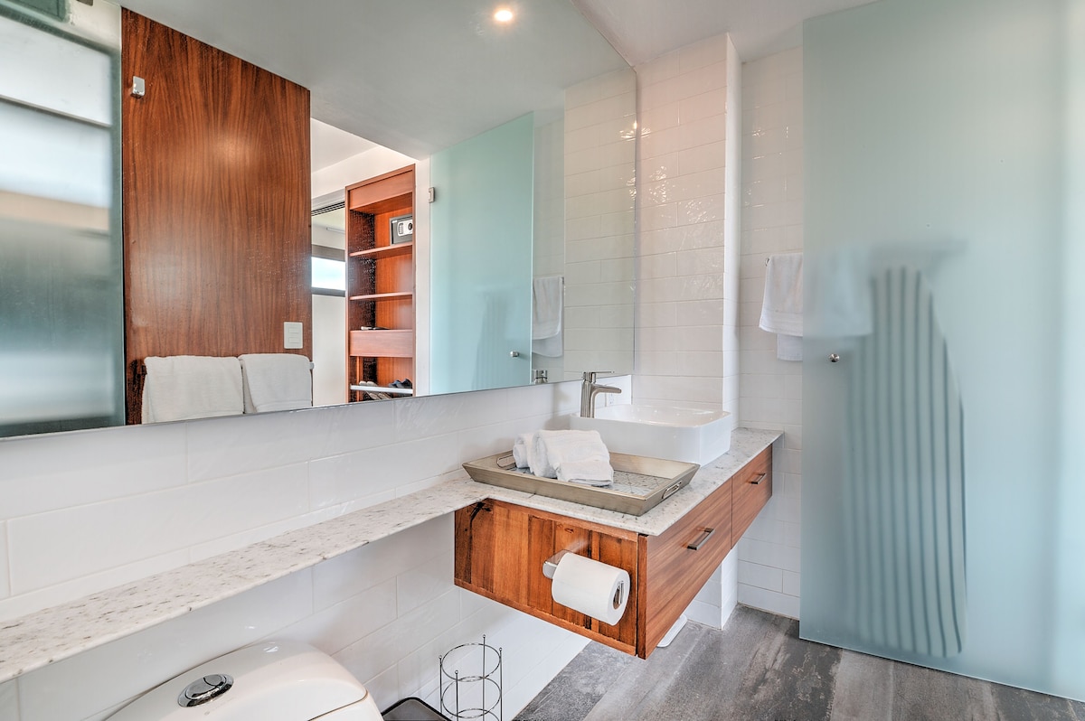Bathroom vanity, large mirror and glass shower