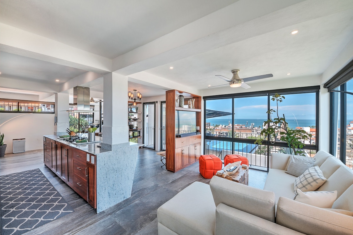 Living area and kitchen opening onto views of Puerto Vallarta