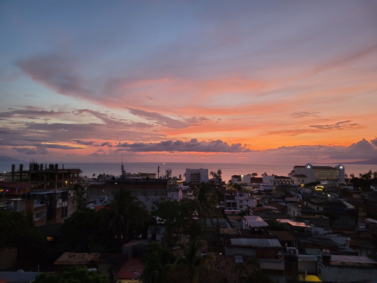 Pink and orange sunset above Puerto Vallarta and the ocean